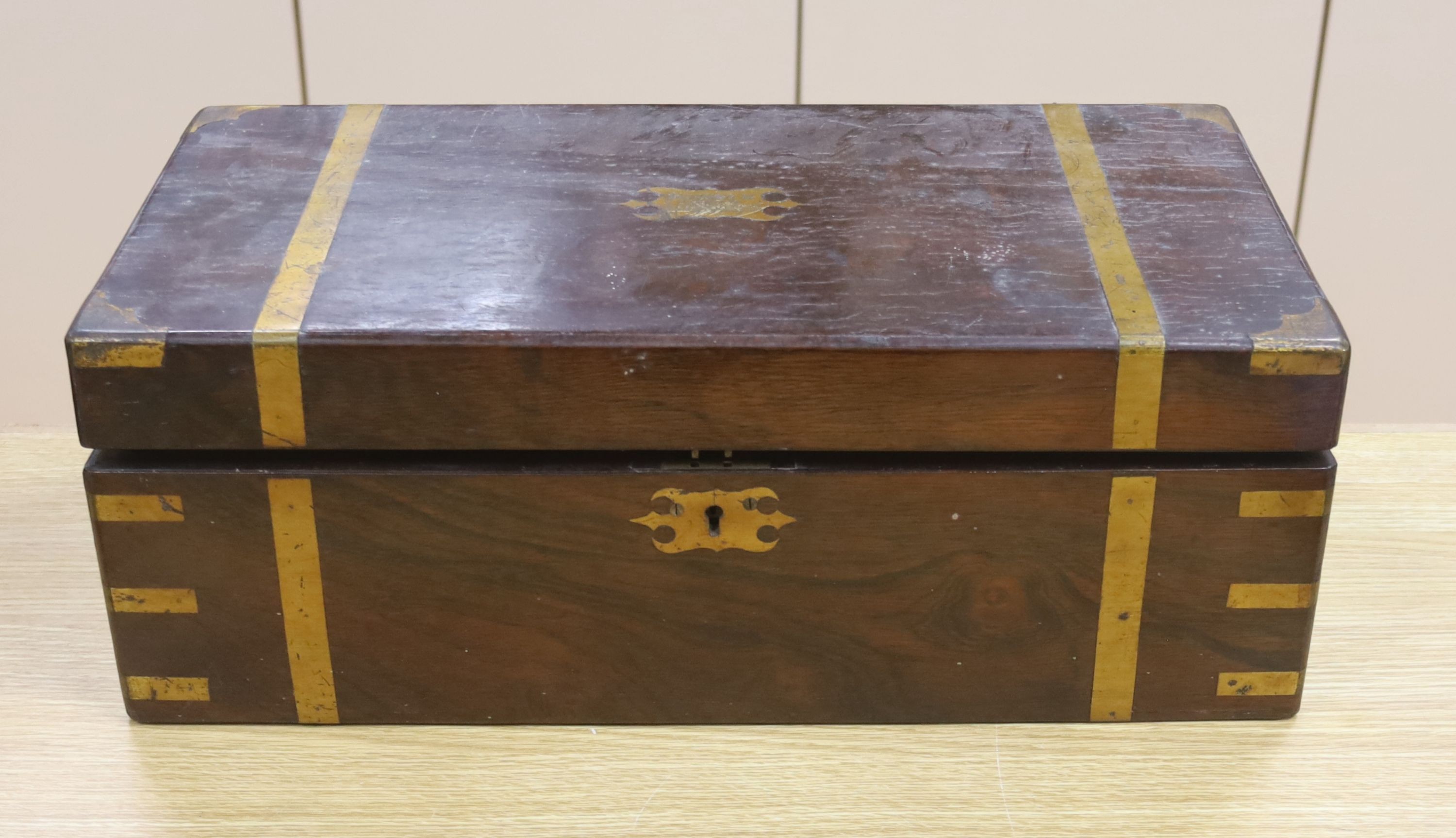 A victorian rosewood brass bound writing slope, 19 x 50cm, and a hand written Victorian ledger